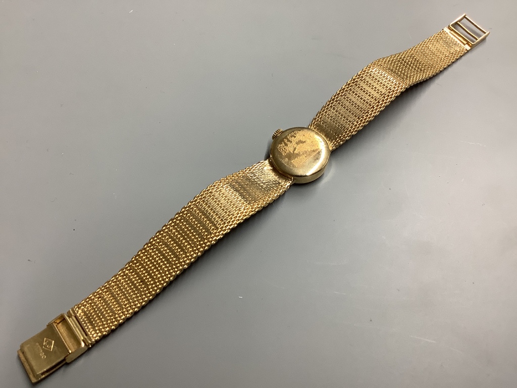 A lady's modern 9ct gold Avia manual wind wrist watch, on integral 9ct gold bracelet, overall 17.5cm